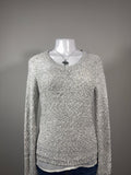 Y2K Apt. 9 silver sequin knit sweater featuring a soft marled knit with subtle shimmer throughout. A cozy yet elevated piece that's perfect for layering with jeans, skirts, or trousers for an effortless Y2K-inspired look.