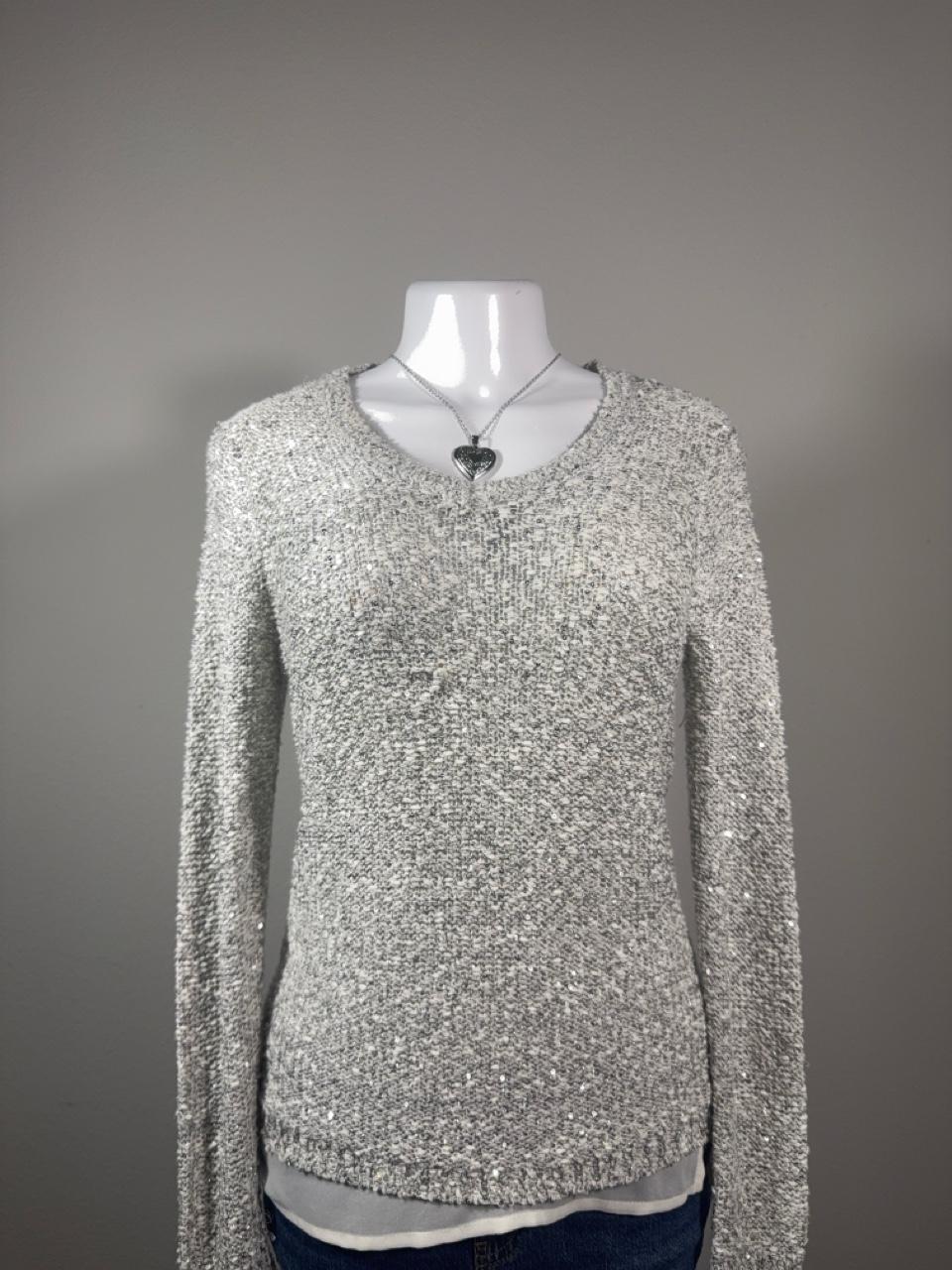 Y2K Apt. 9 silver sequin knit sweater featuring a soft marled knit with subtle shimmer throughout. A cozy yet elevated piece that's perfect for layering with jeans, skirts, or trousers for an effortless Y2K-inspired look.