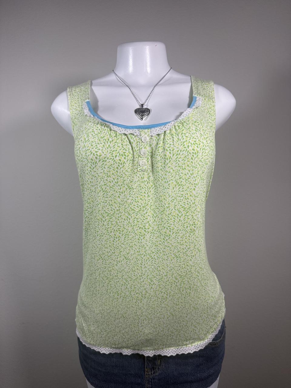 Fairycore Y2K George light green floral lace trim tank top featuring a soft allover leaf print, decorative button front, and delicate eyelet lace details. A cute everyday layering piece that's perfect for spring, cottagecore, or casual Y2K outfits.