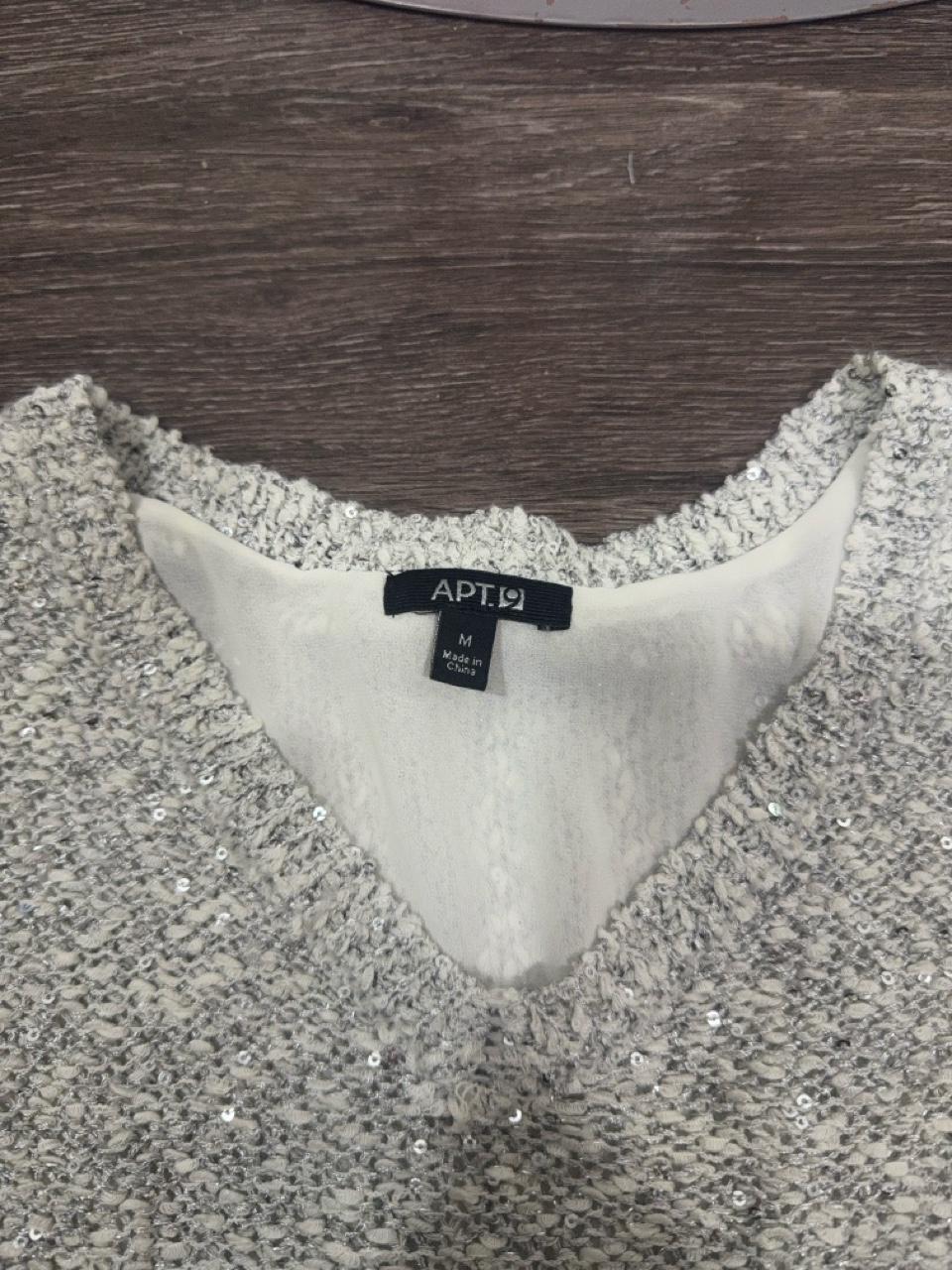 Y2K Apt. 9 silver sequin knit sweater featuring a soft marled knit with subtle shimmer throughout. A cozy yet elevated piece that's perfect for layering with jeans, skirts, or trousers for an effortless Y2K-inspired look.